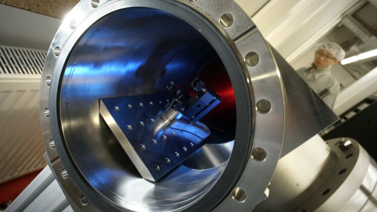 Mr. Yinyu Zhang working at the delay line of a femtosecond laser system.