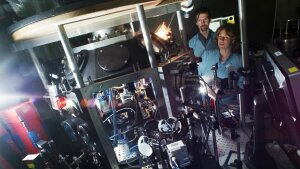 Dr. Burgard Beleites and Dr. Matthew Schwab in the laser target chamber of the nonlinear optics lab.