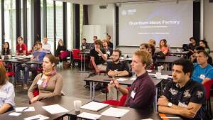 Students sitting in the conference room and listening